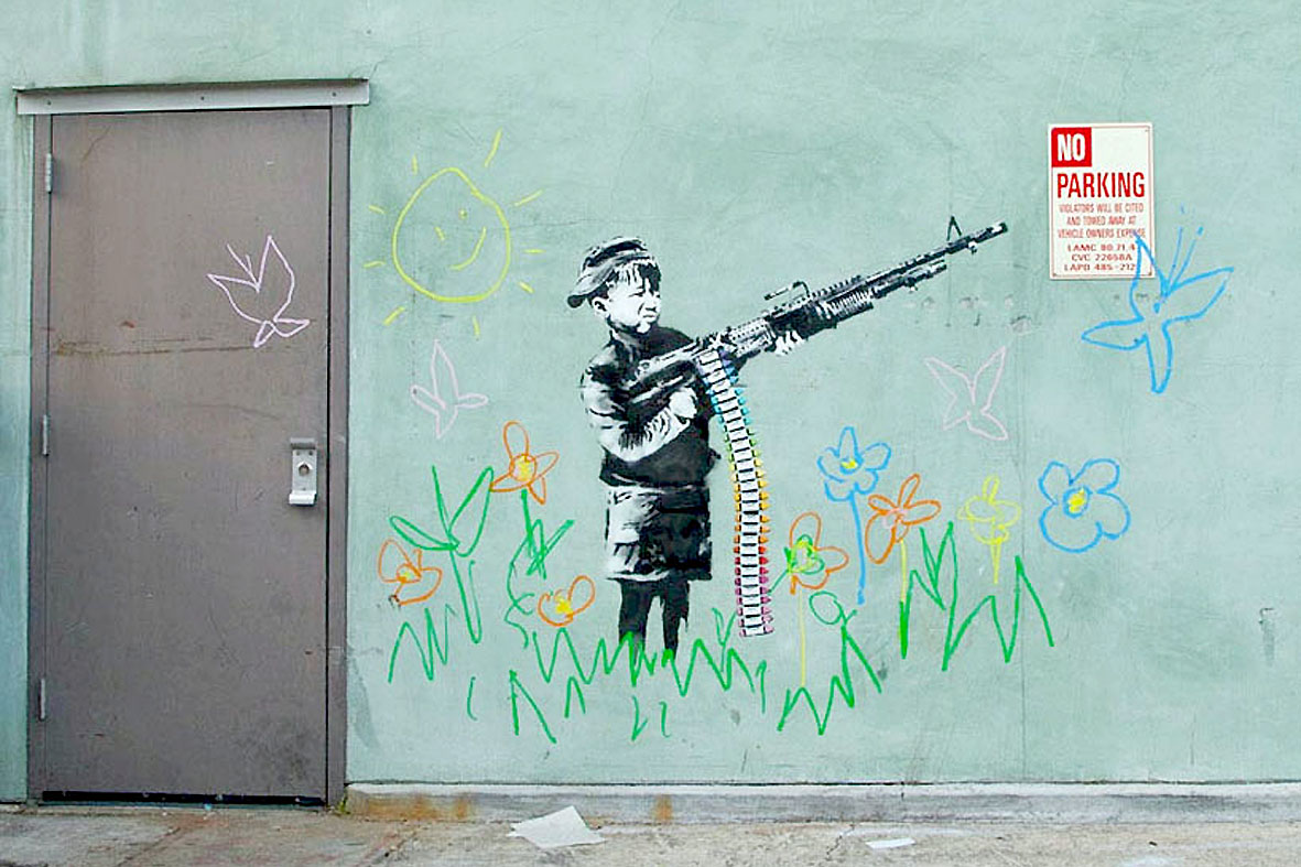 Um dos grafites de Banksy numa parede de Hollywood